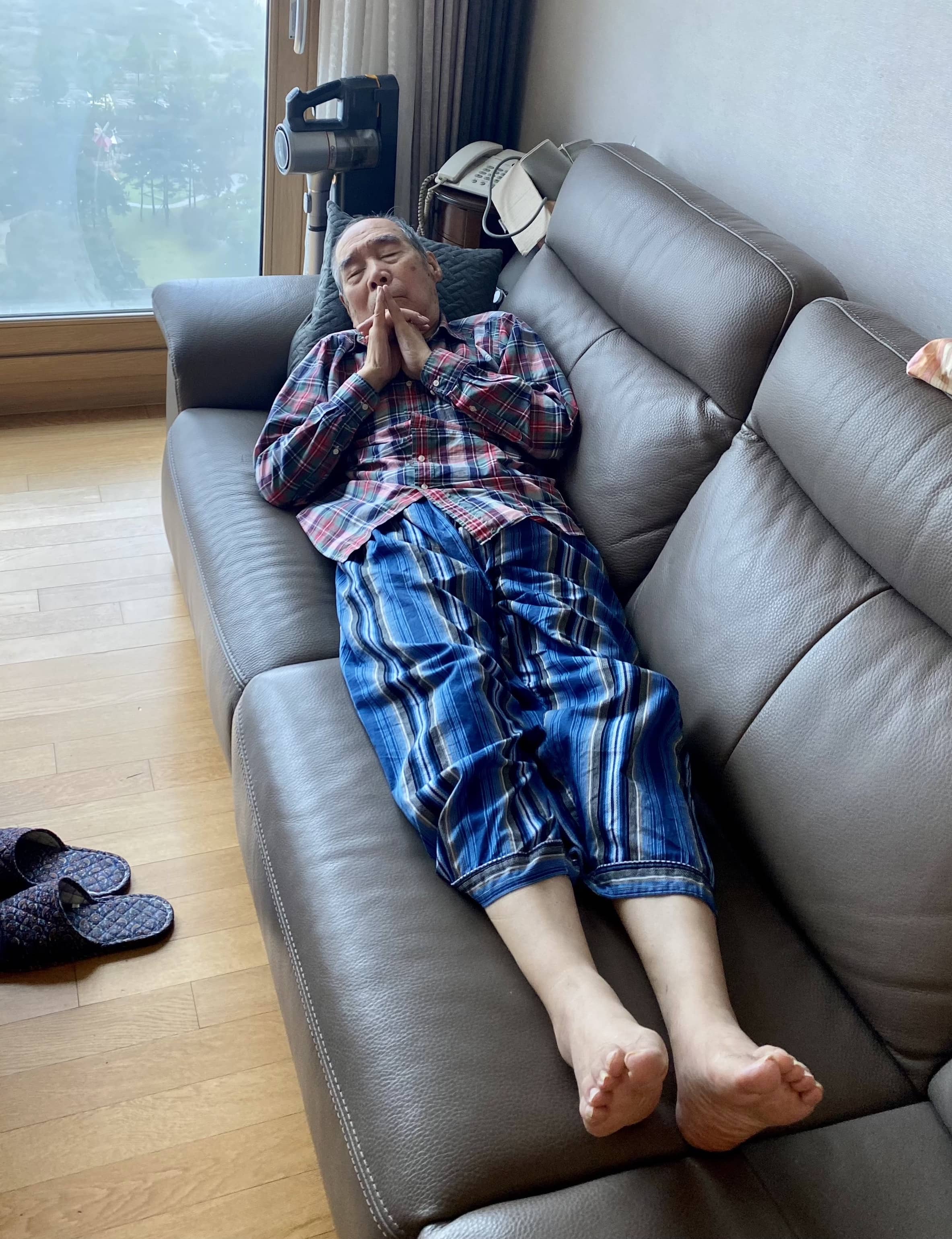 Grandpa laying down on sofa