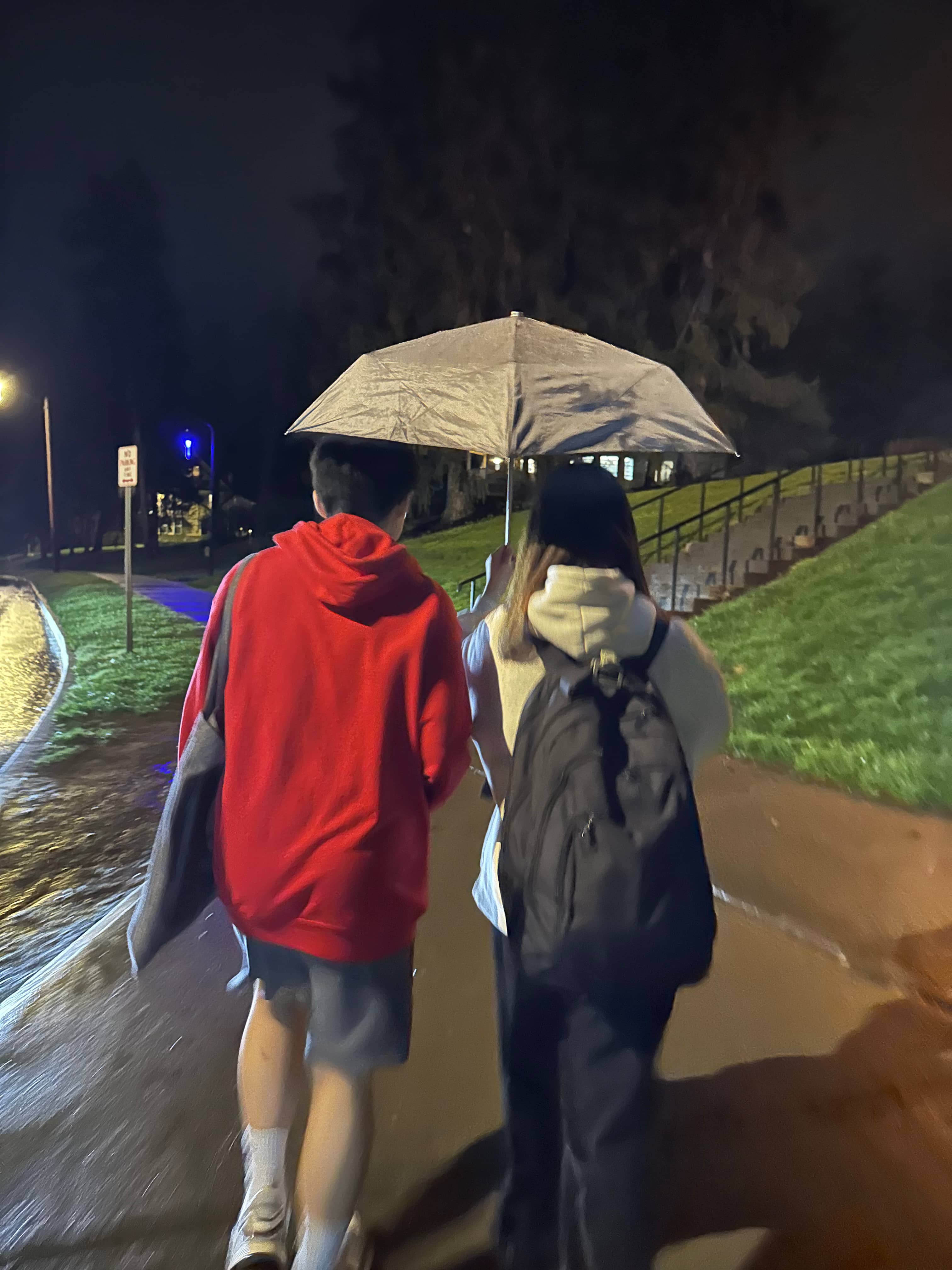 Elaine and Ben under an umbrella